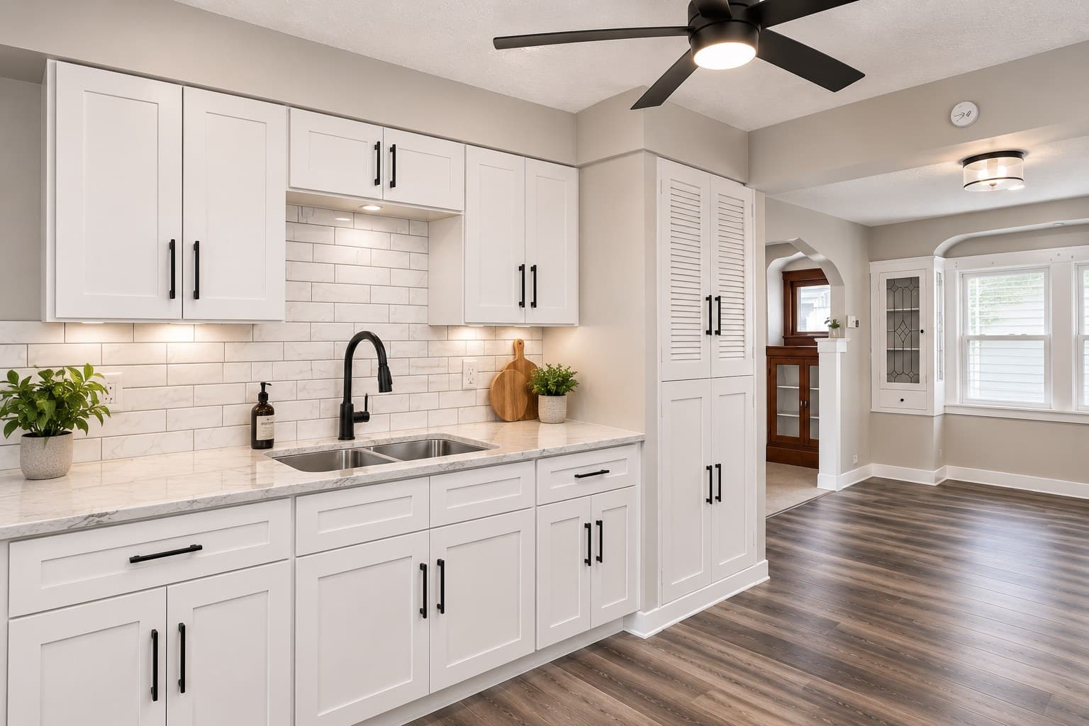 Completed white kitchen remodel with new cabinetry and countertops