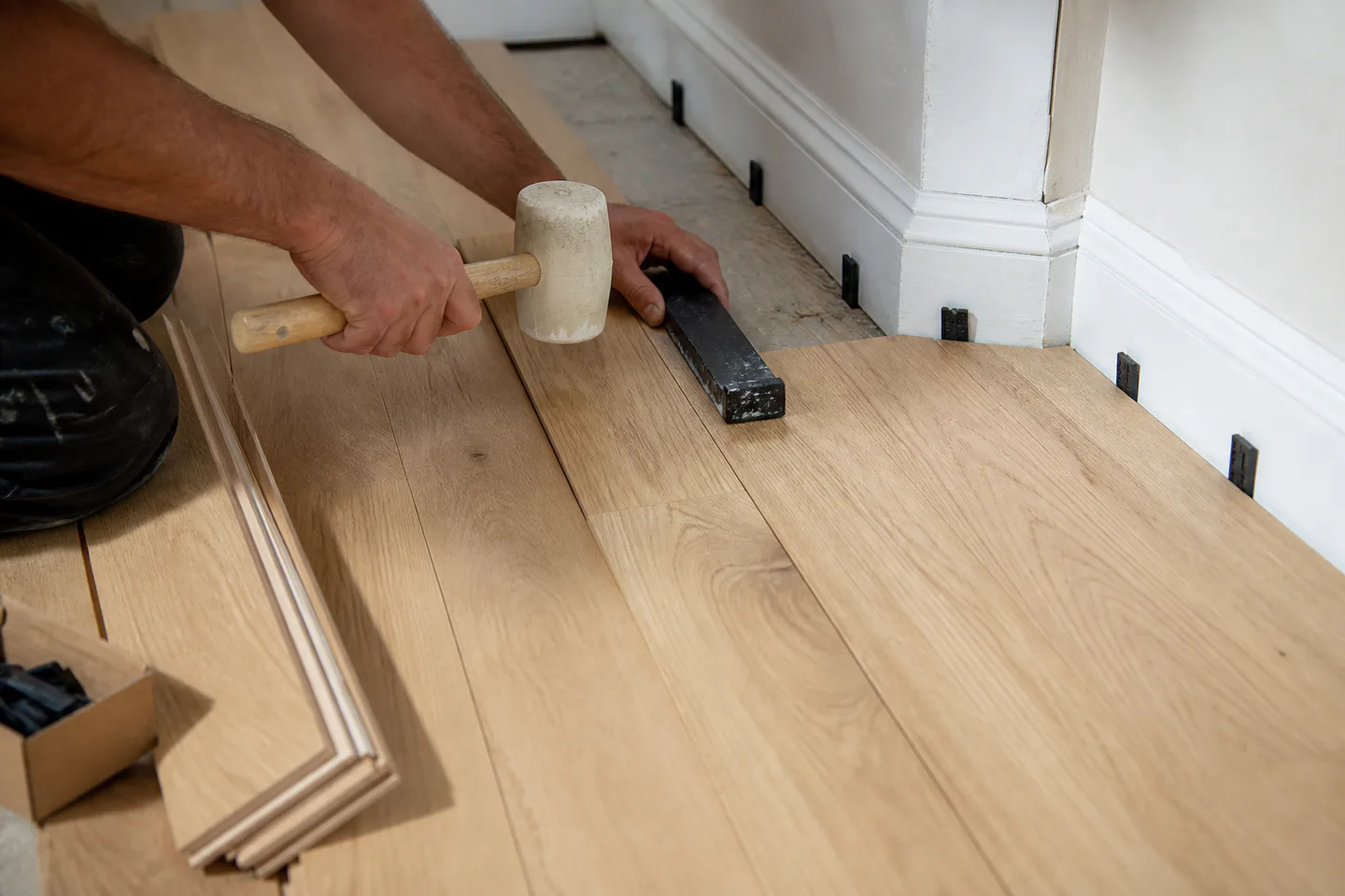 White oak flooring installation around original trim