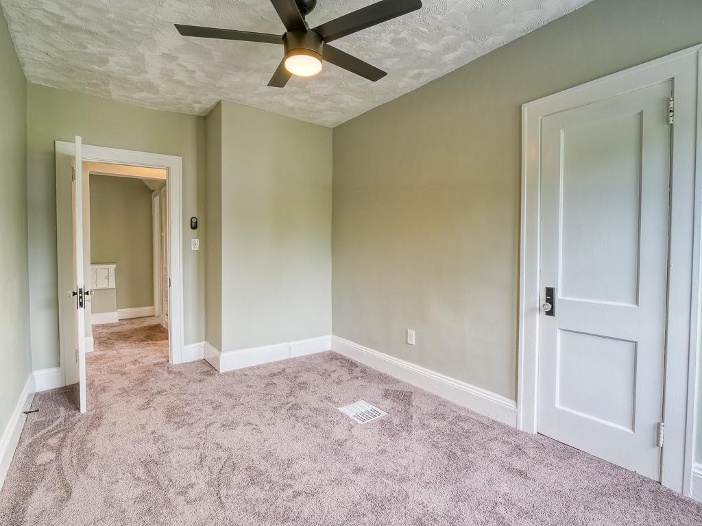 Finished carpeted bedroom viewed from the doorway