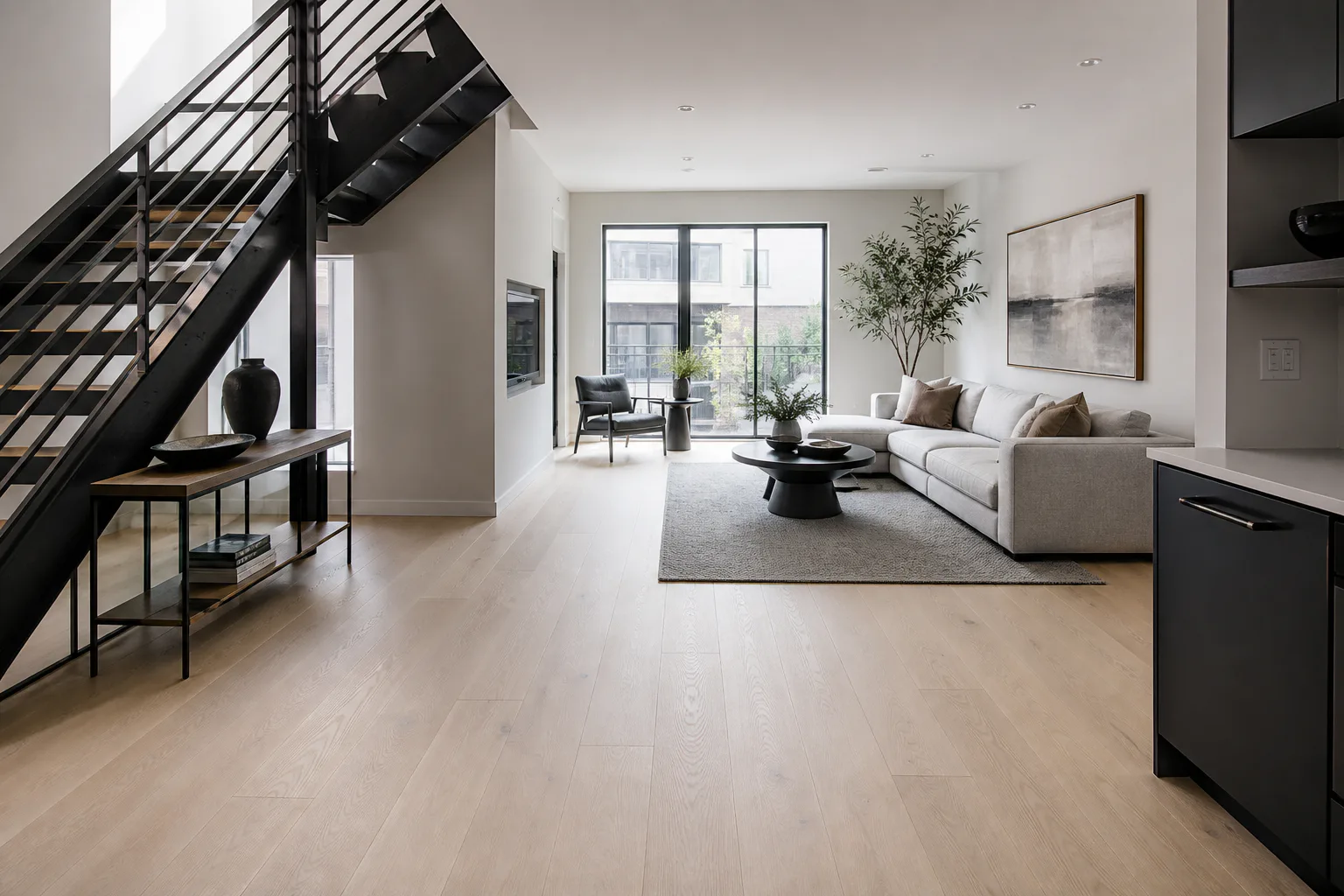 Pale matte wide-plank oak flooring in a contemporary townhouse