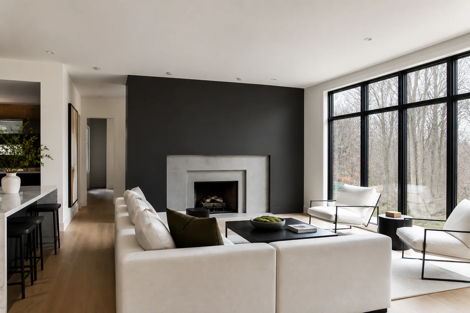 Contemporary living room interior painting with off-white walls and a charcoal feature wall
